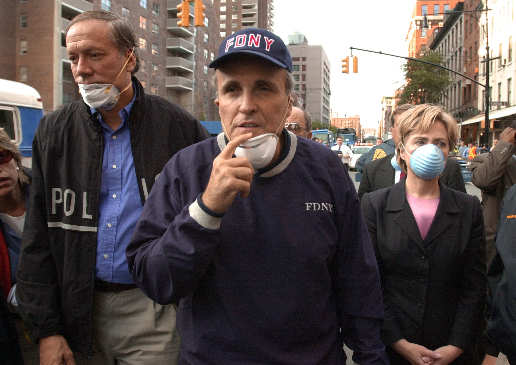 New York Governor George Pataki (L), New York City Mayor Rudolph Giuliani (C) and US Senator Hillary Rodham Clinton tour world trade center after 9/11