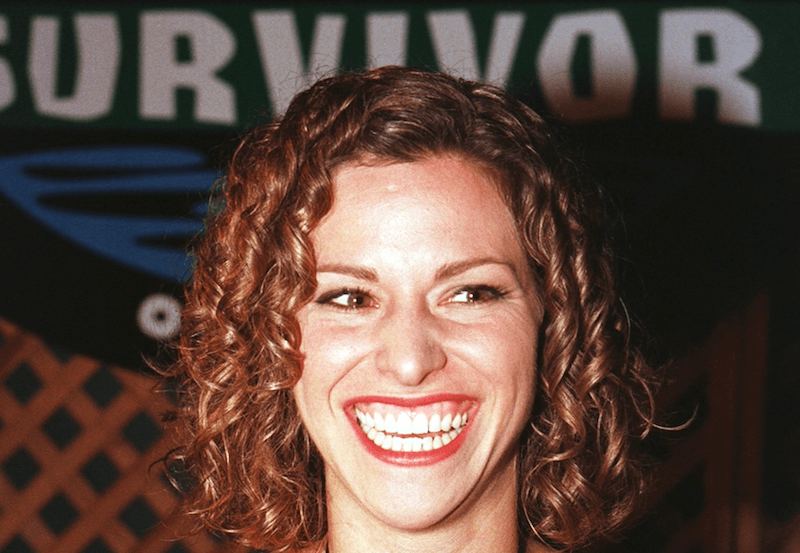 Stacey Stillman smiling while at a red carpet event. 