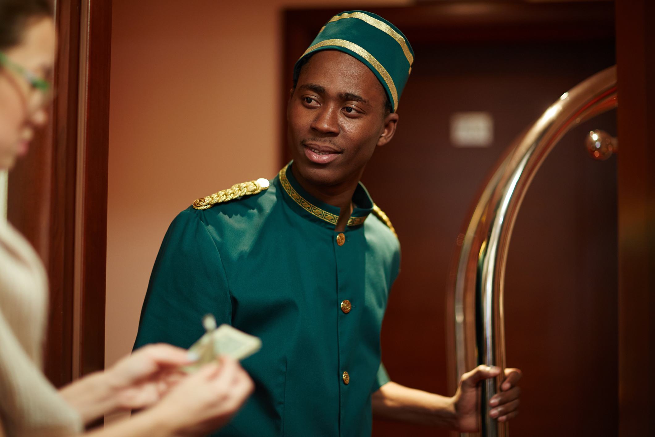 Bellboy Getting Tips from Guests