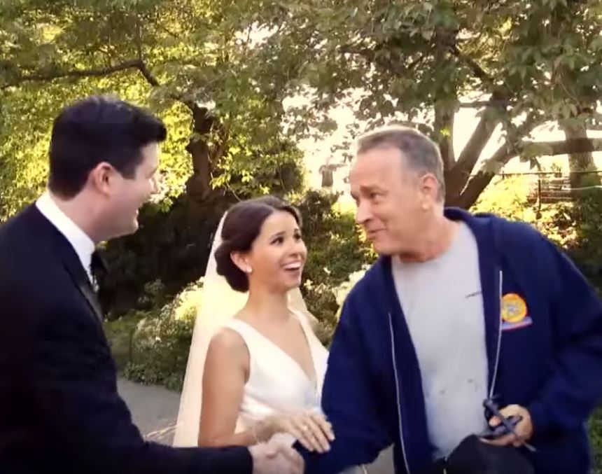 Tom Hanks greets the couple.