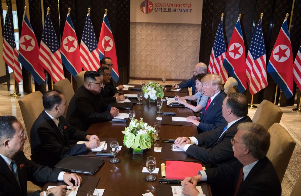 US President Donald Trump (3rd R) and North Korea's leader Kim Jong Un
