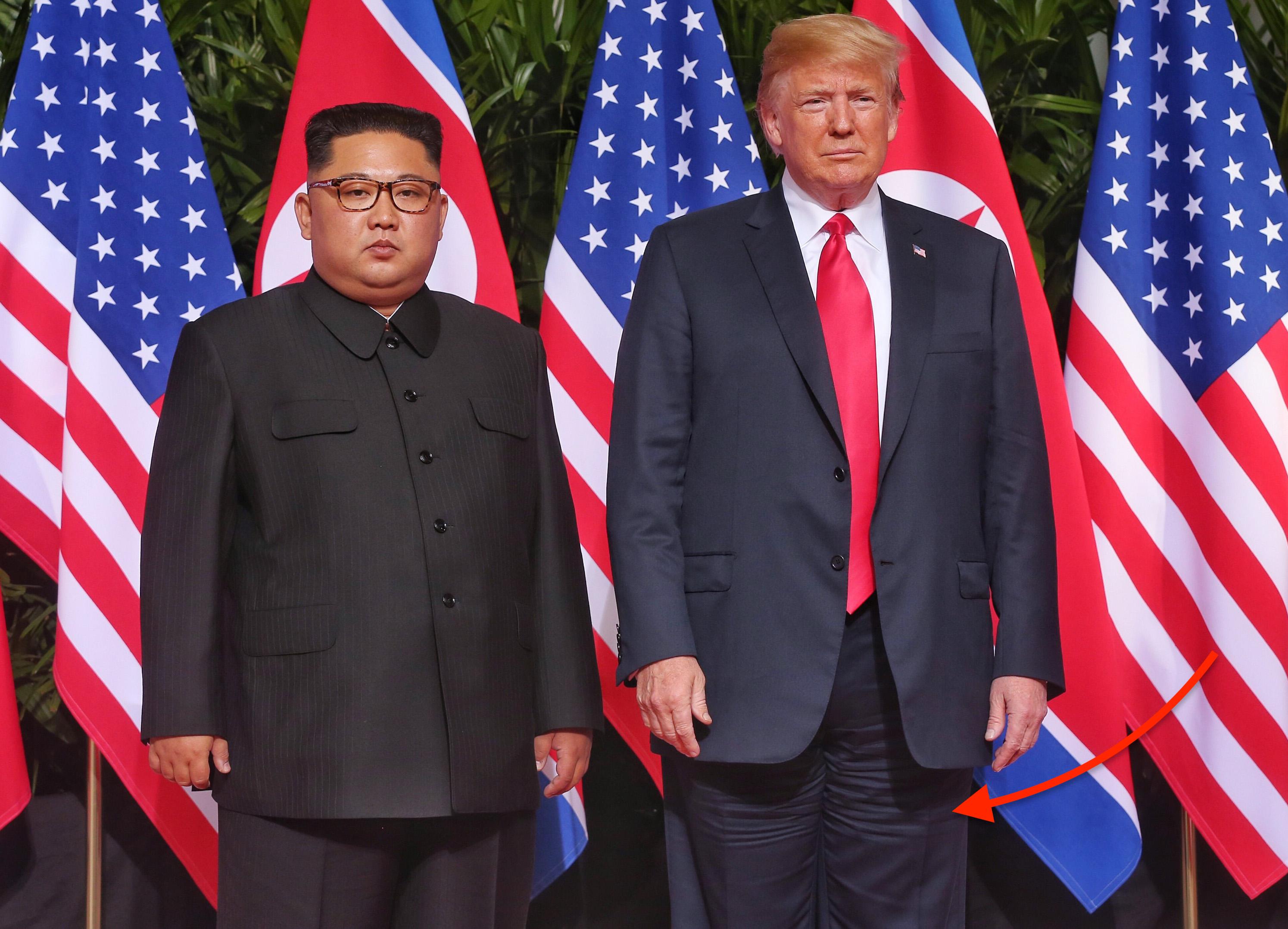 U.S. President Trump Meets North Korean Leader Kim Jong-un During Landmark Summit In Singapore focus on suit wrinkles