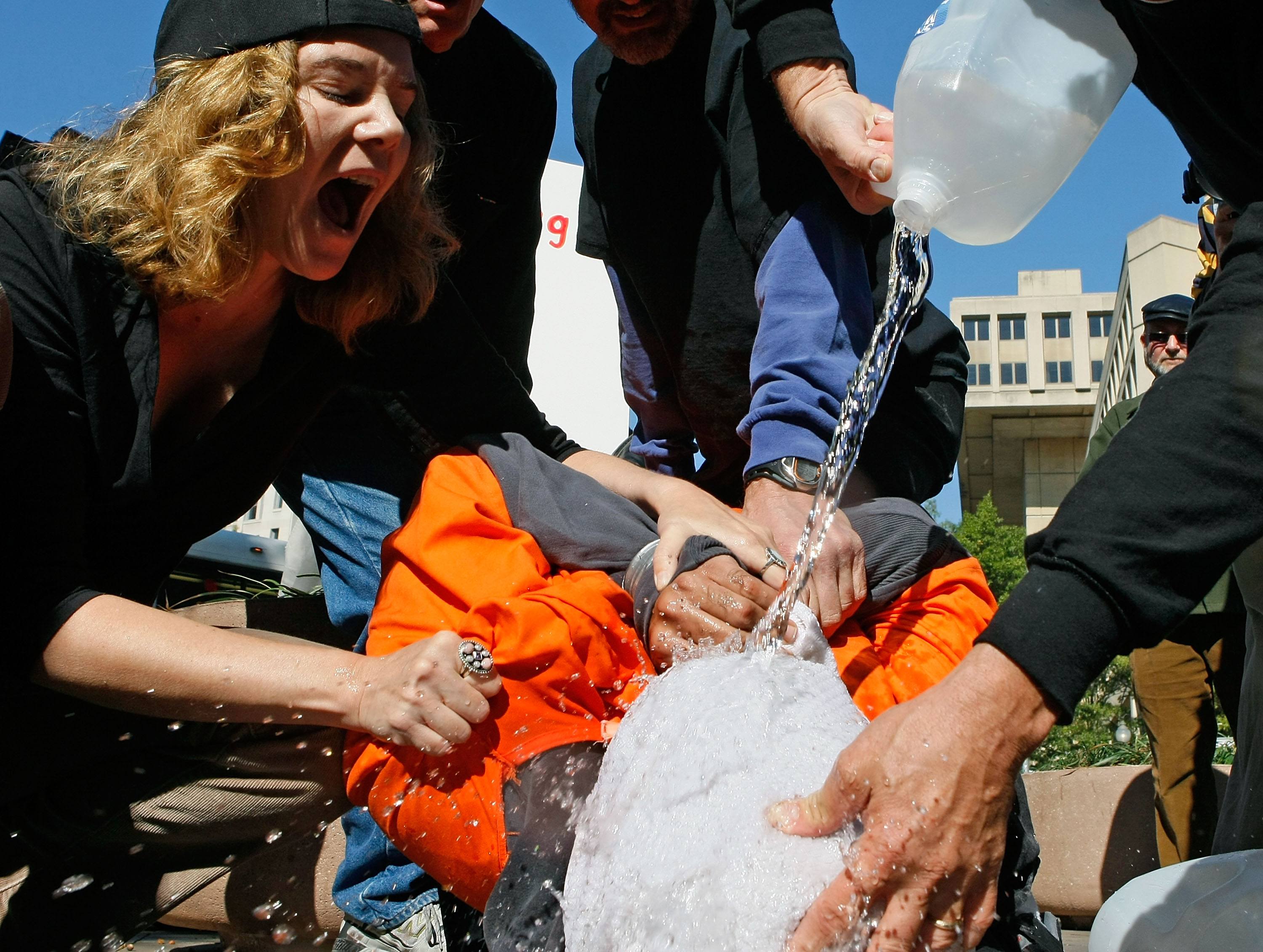Anti-torture Protestors Hold Demonstration Of "Waterboarding"