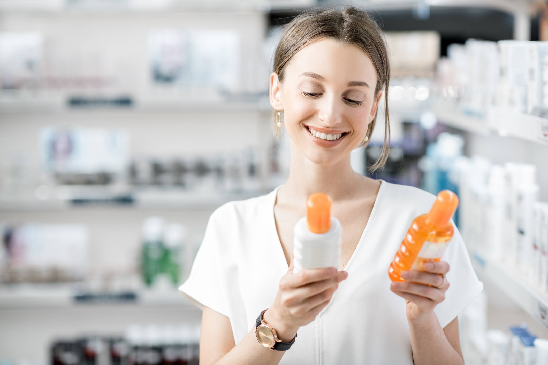 worst spray sunscreens Woman choosing sunscreen