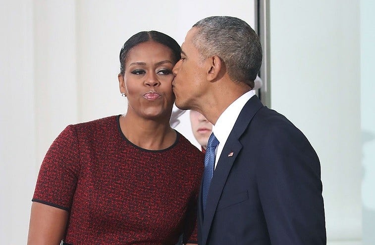 President Barack Obama gives a kiss to his wife first lady Michelle Obama before the arrival of President-elect Donald Trump and his wife Melania Trump, at the White House on January 20, 2017 in Washington, DC. Later in the morning President-elect Trump will be sworn in as the nation's 45th president during an inaugural ceremony at the U.S. Capitol.