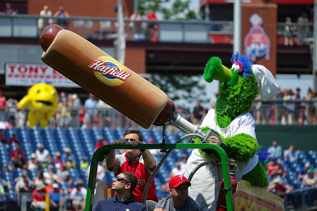 The Phillie Phanatic launches Hatfield hotdogs into the stands.
