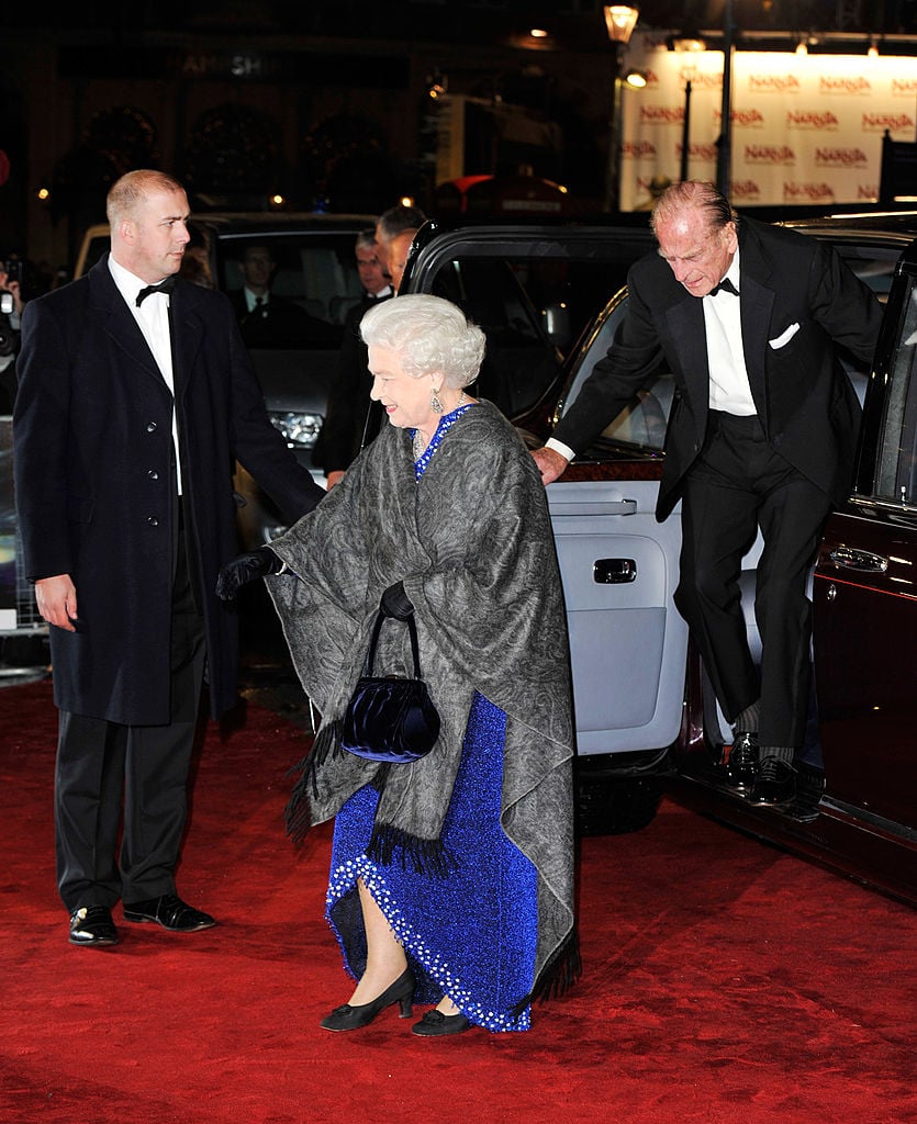 Queen Elizabeth and Prince Philip arrive on the red carpet.