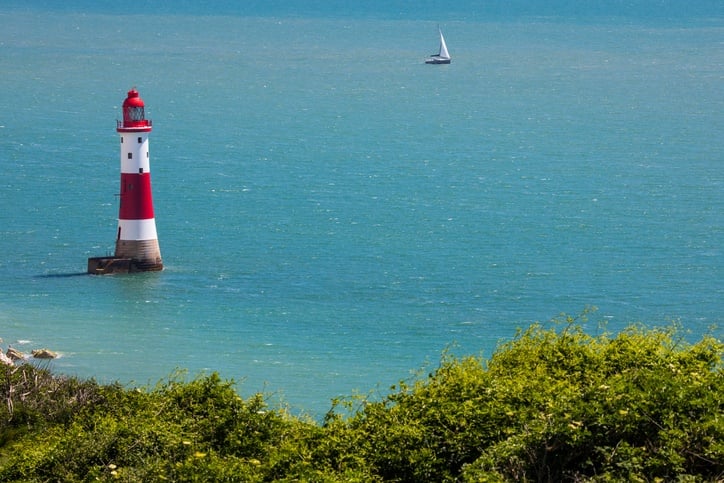 A view of Beachy Head Lighthouse on the English Channel in East Sussex, UK.