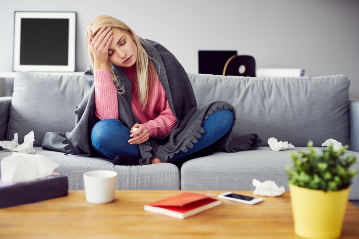 Sick woman with headache