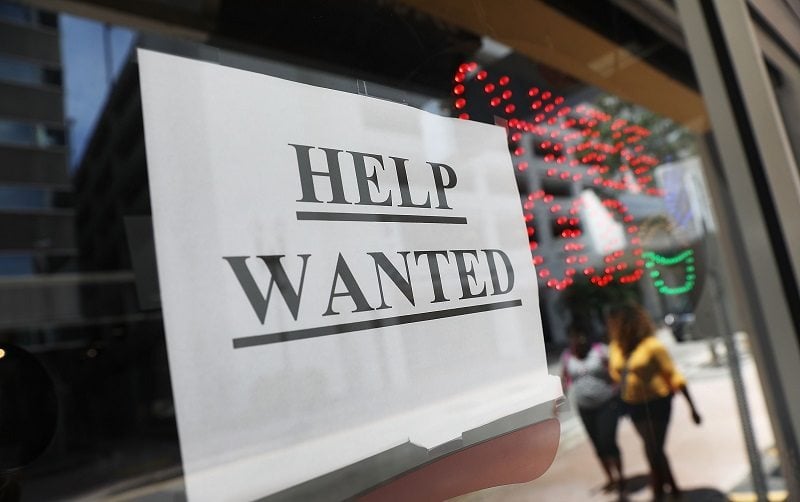 MIAMI, FL - JUNE 01: A "help wanted" sign hangs on a window of a restaurant on June 1, 2018 in Miami, Florida. The U.S. economy gained a stronger-than-expected 223,000 jobs last month and the unemployment rate edged down to an 18-year low.