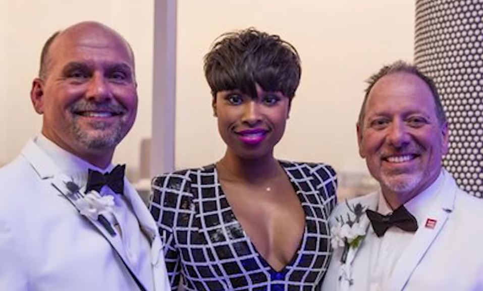 Jennifer Hudson poses with the grooms.