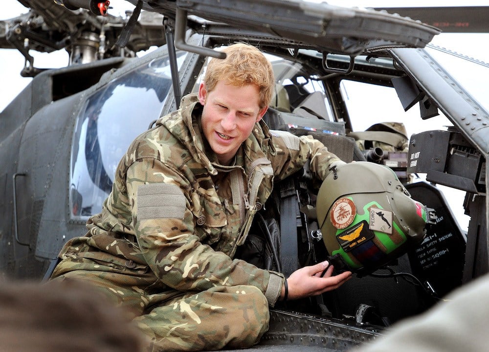 Prince Harry makes early morning checks as he sits on an Apache helicopter at the British controlled flight-line at Camp Bastion in Afghanistan