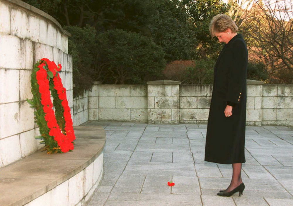 Princess Diana stands in silence after laying a wreath at a memorial to the war dead of the British Commonwealth