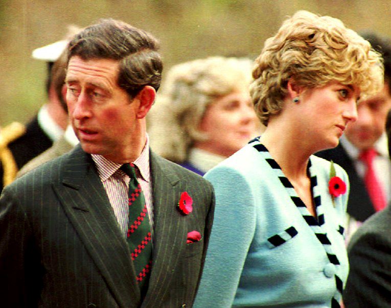 The Prince and Princess of Wales stand 03 November at the memorial to the British Gloster Regiment