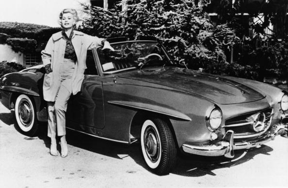 US actress Zsa Zsa Gabor poses on May 12, 1958, in front of her Mercedes car