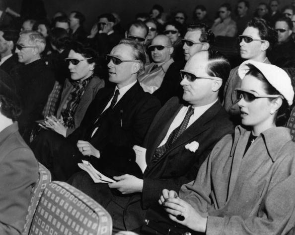 Cinema-goers wearing 3D glasses at a special Festival of Britain three dimensional film screening