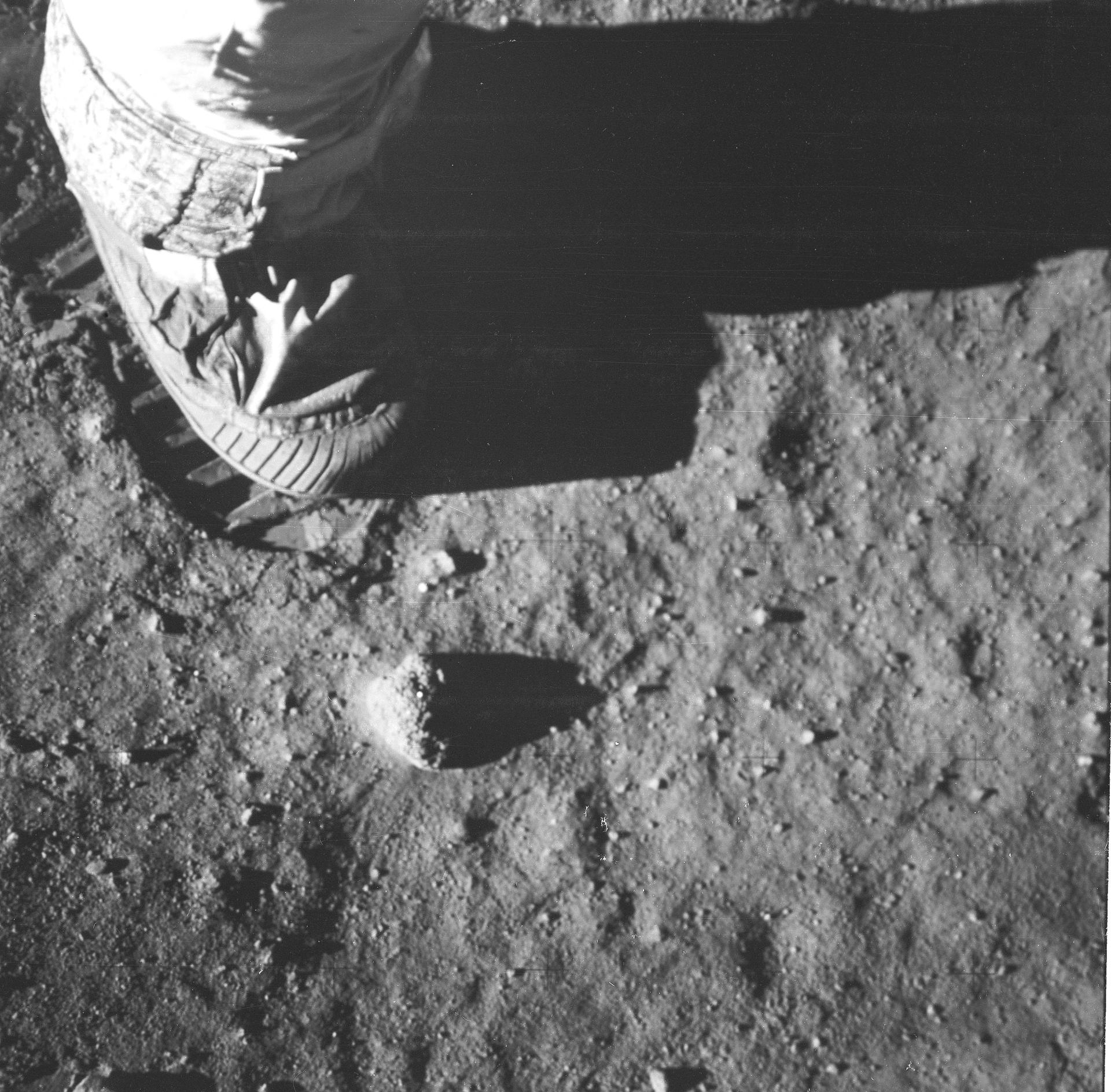 An Apollo 11 astronaut's foot and footprint in the lunar soil