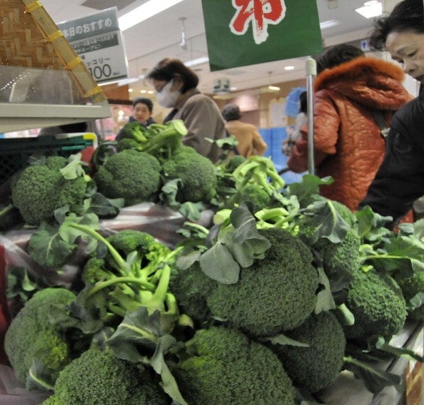 Shoppers buy broccoli sprouts at a supermarket in Tokyo Shoppers buy broccoli sprouts at a supermarket in Tokyo
