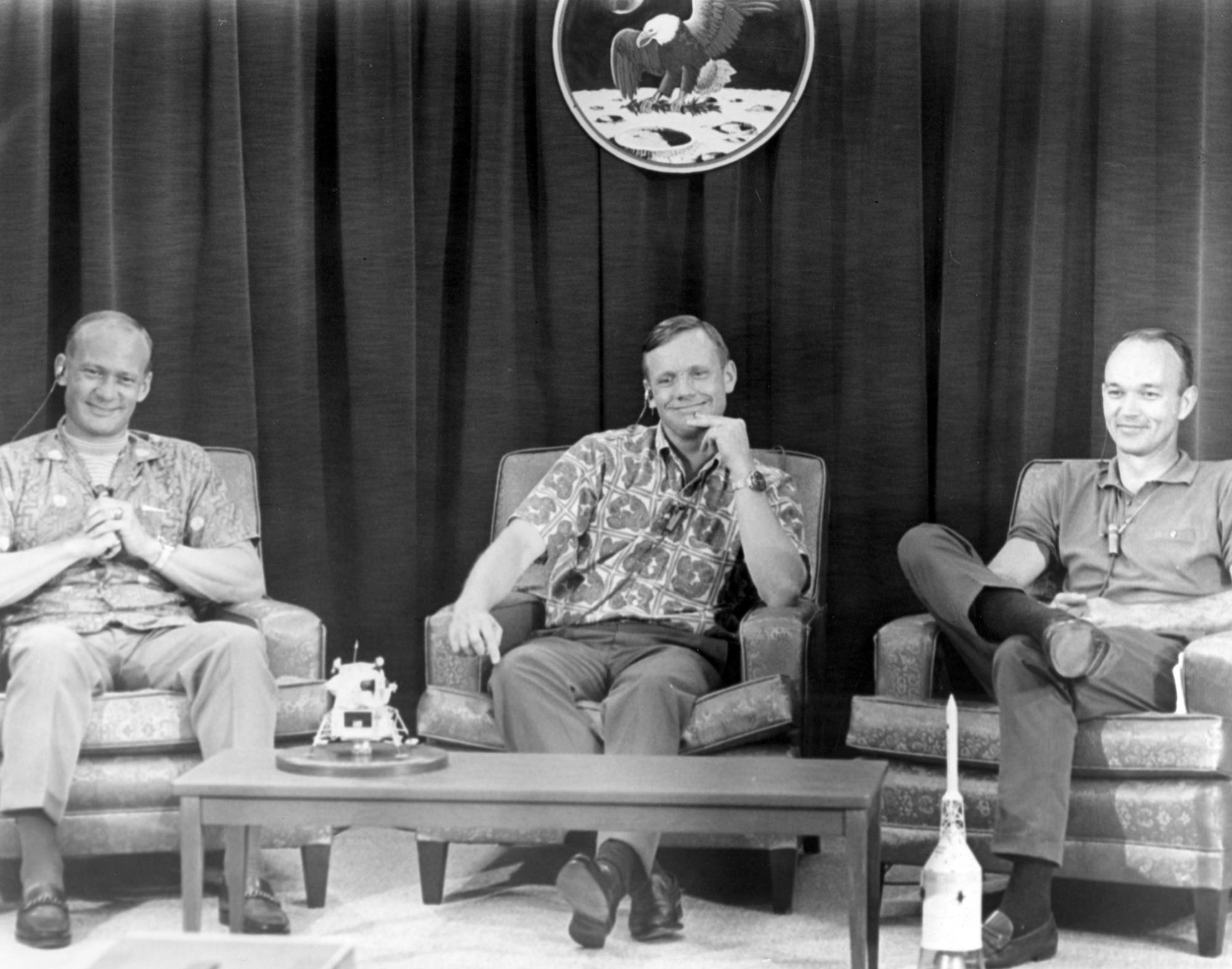Buzz Aldrin, Neil Armstrong, and Michael Collins conduct a press conference