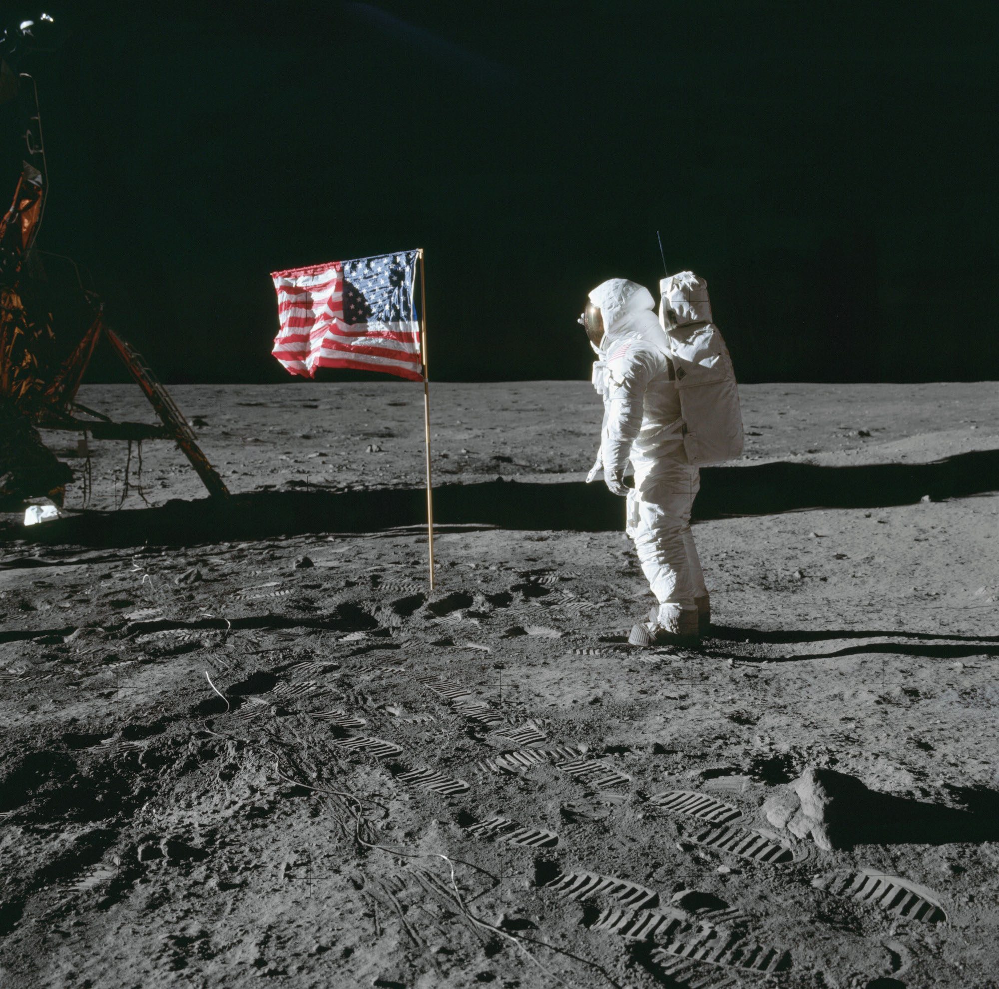 Buzz Aldrin poses beside the deployed United States flag during Apollo 11 extravehicular activity on the lunar surface