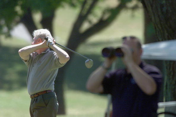 President Clinton working on his golf swing
