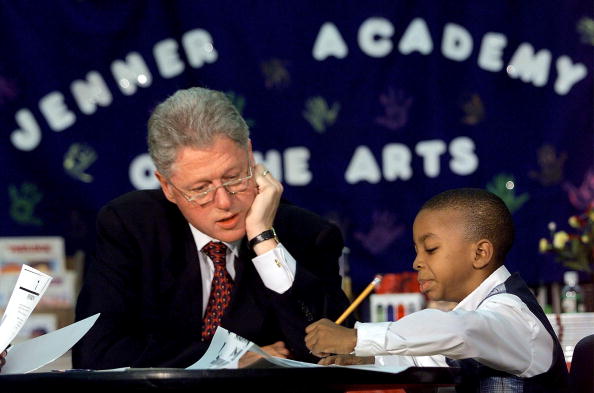 Bill Clinton helps tutor a student