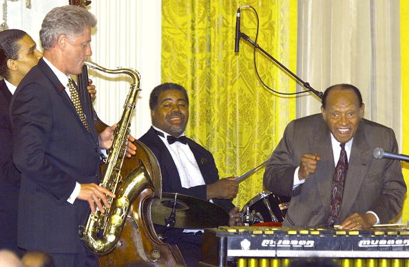 Bill Clinton plays the saxophone