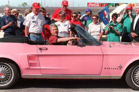 Bill Clinton in a Ford Mustang