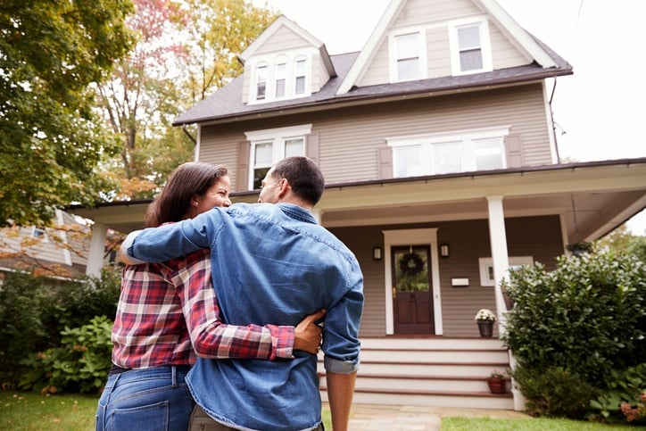 Couple outside home