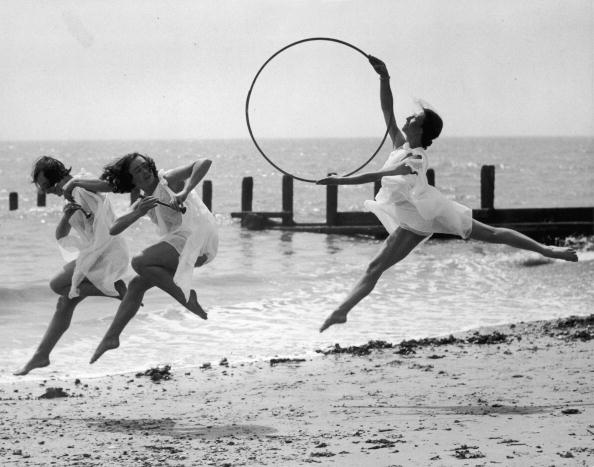 Three members of a dance school rehearse for an upcoming performance on the beach at Worthing. Three members of a dance school rehearse for an upcoming performance on the beach at Worthing.