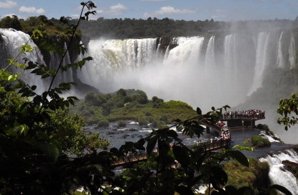 Tourists enjoy the Iguazu Falls Tourists enjoy the Iguazu Falls