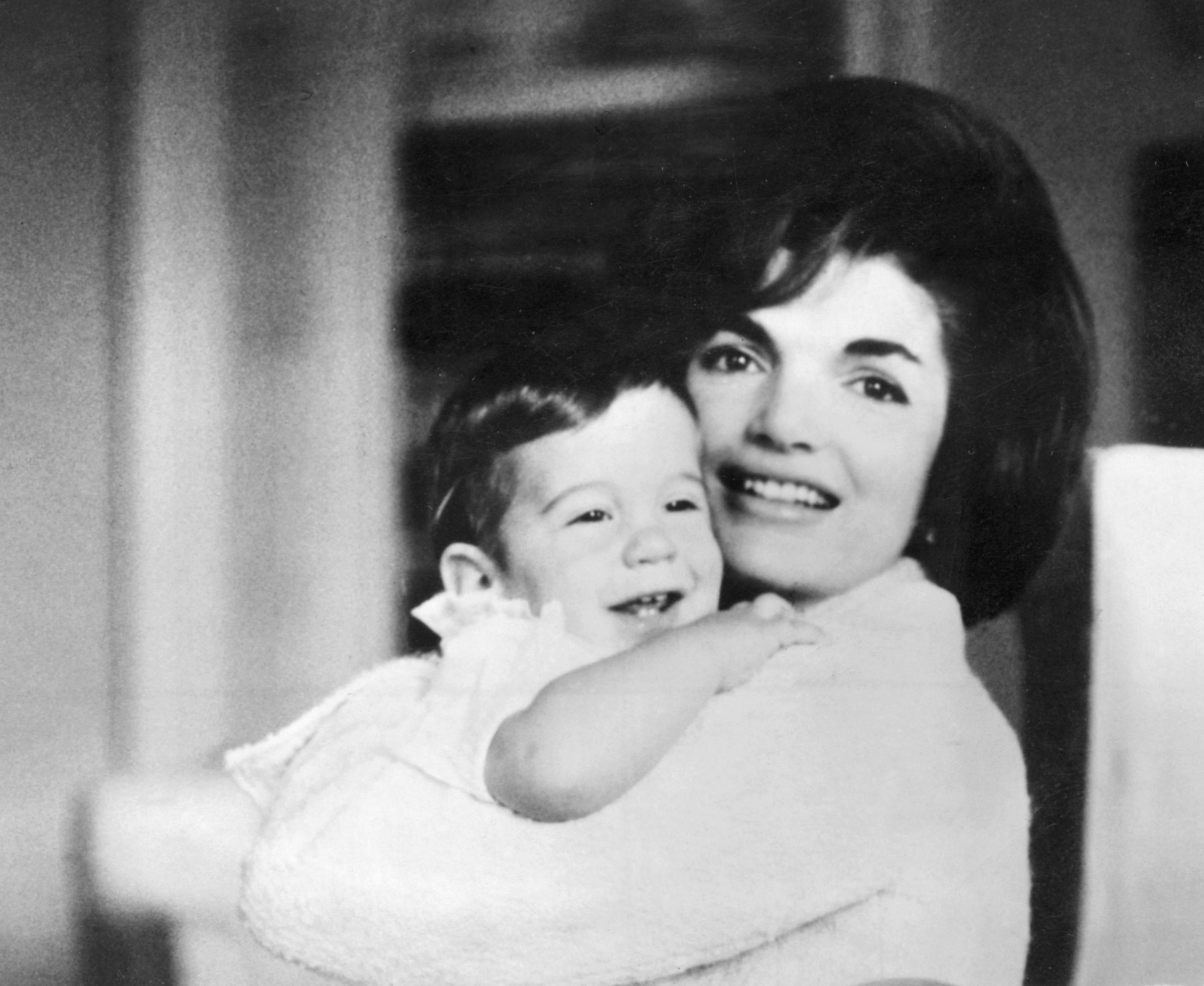 Jacqueline Kennedy holds John Jr.