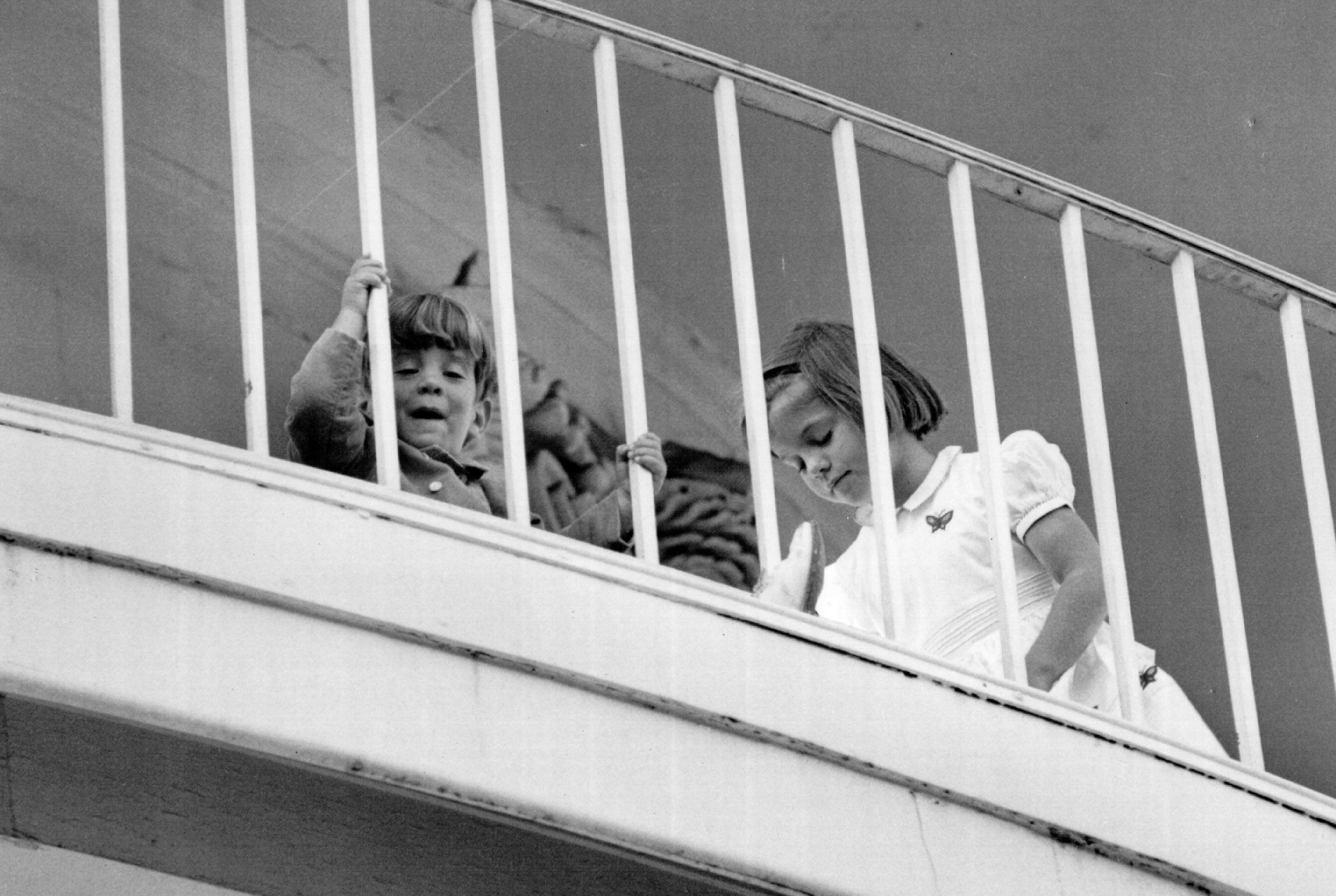 John F Kennedy Jr. and Caroline play on the South Portico of the White House