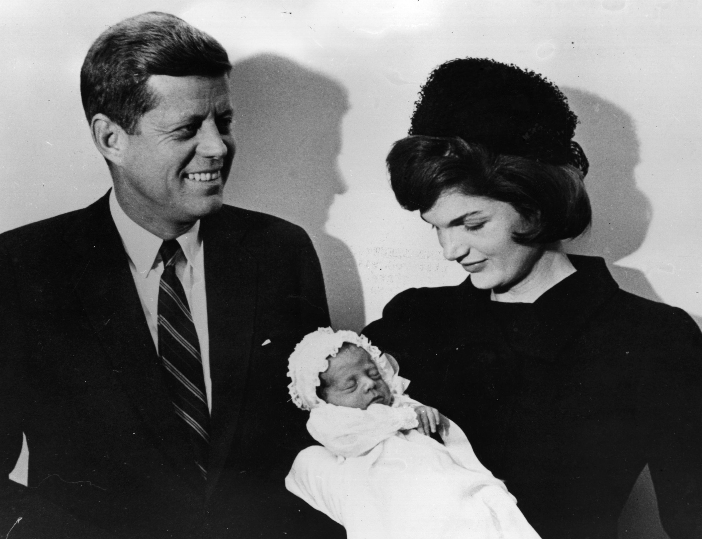 John F. Kennedy and Jacqueline Kennedy at the christening of their son John F Jr.