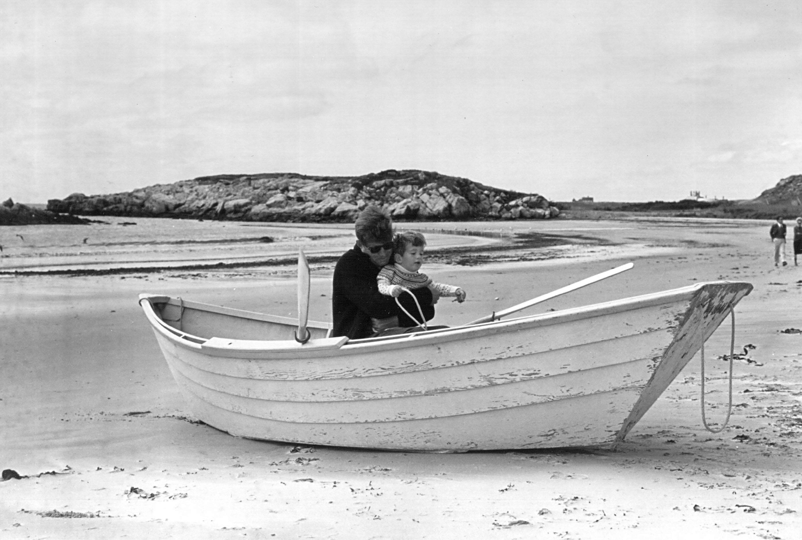 John F. Kennedy with his son, John Jr. on the beach at Newport, Rhode Island