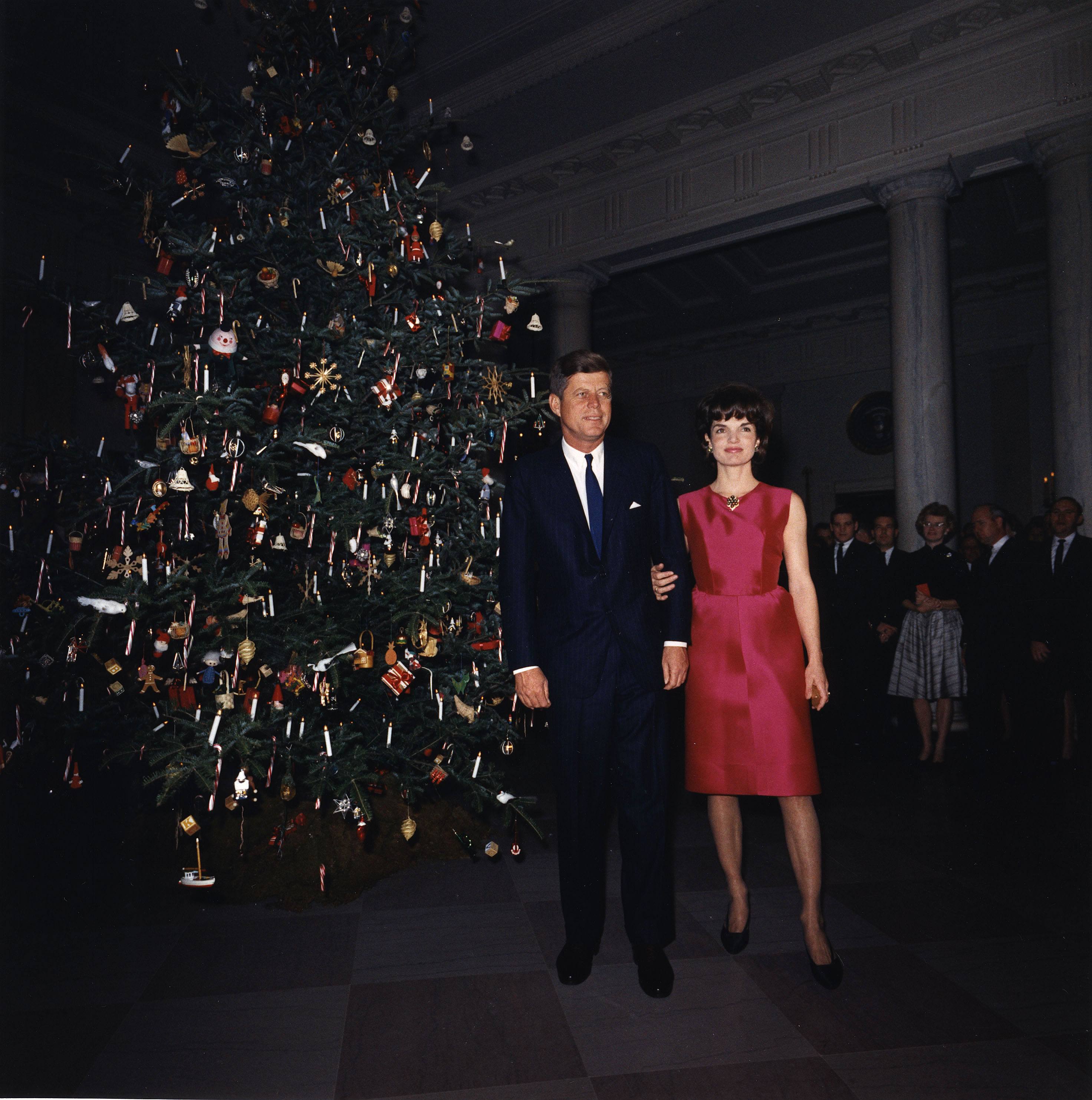 John and Jacqueline Kennedy attend a White House staff Christmas Party