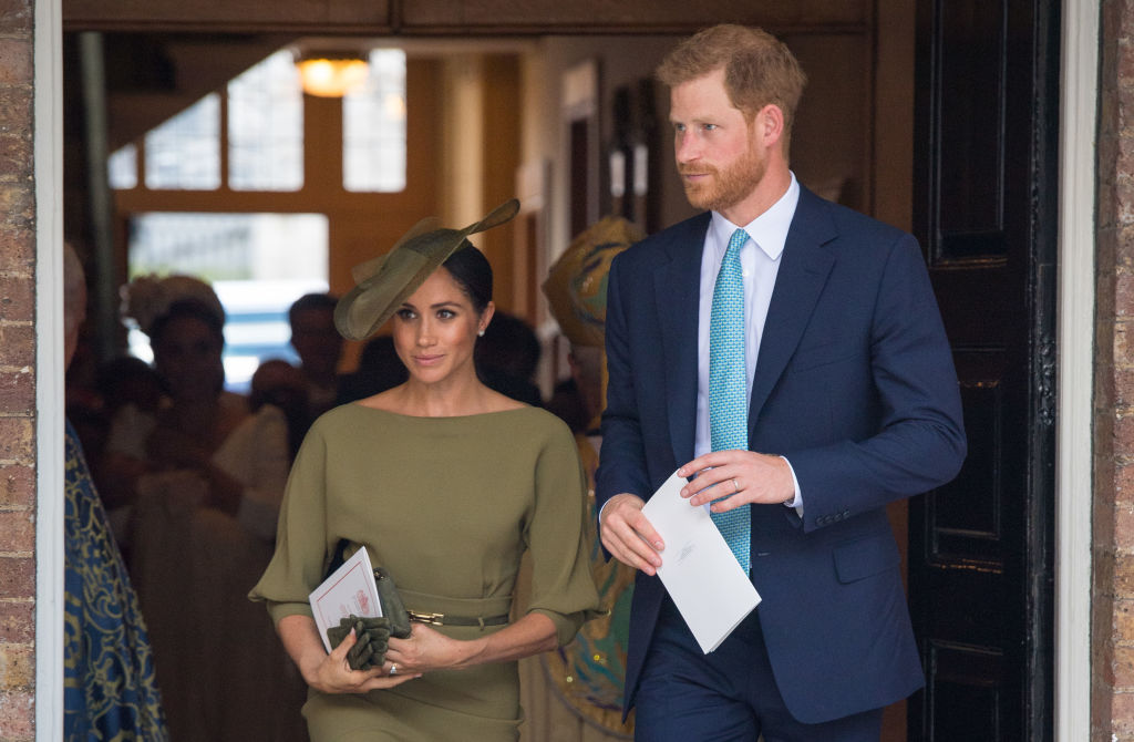 The Duke and Duchess of Sussex depart after attending the christening of Prince Louis at the Chapel Royal, St James's Palace on July 09, 2018 in London, England