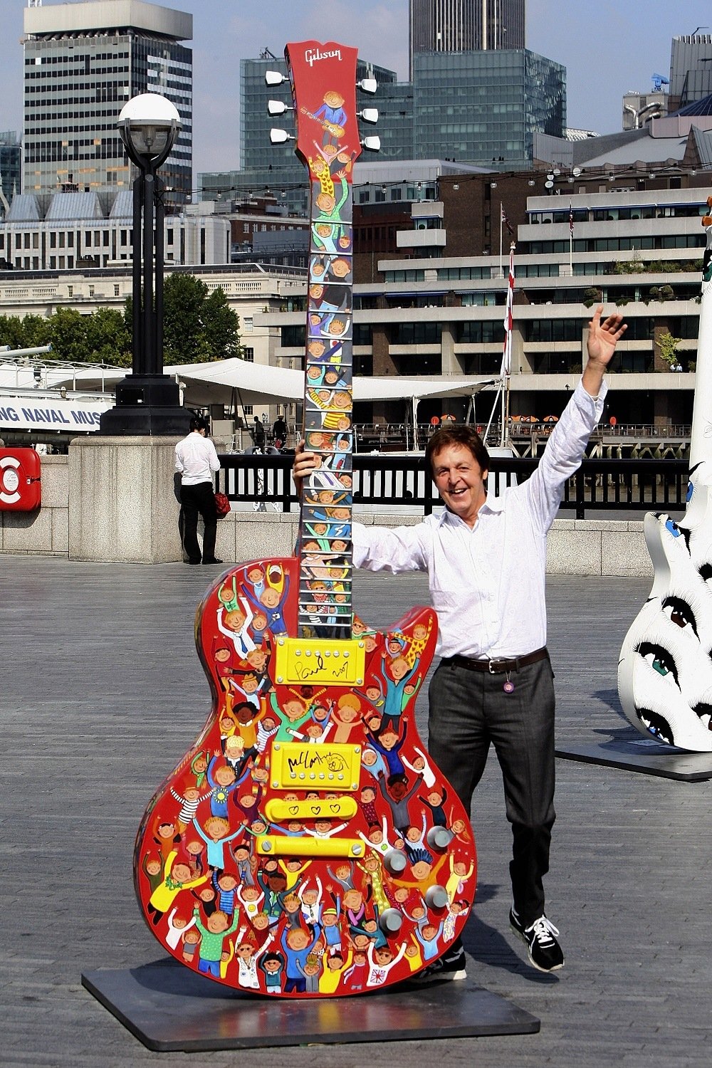 Sir Paul McCartney Signs his ten foot Gibson Les Paul sculpture at More London Riverside by City Hall on September 12, 2007
