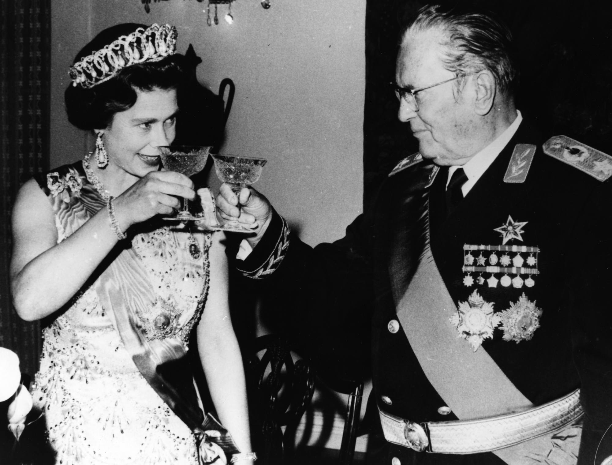President Josip Broz Tito of Yugoslavia raises a glass to share a toast with Queen Elizabeth II