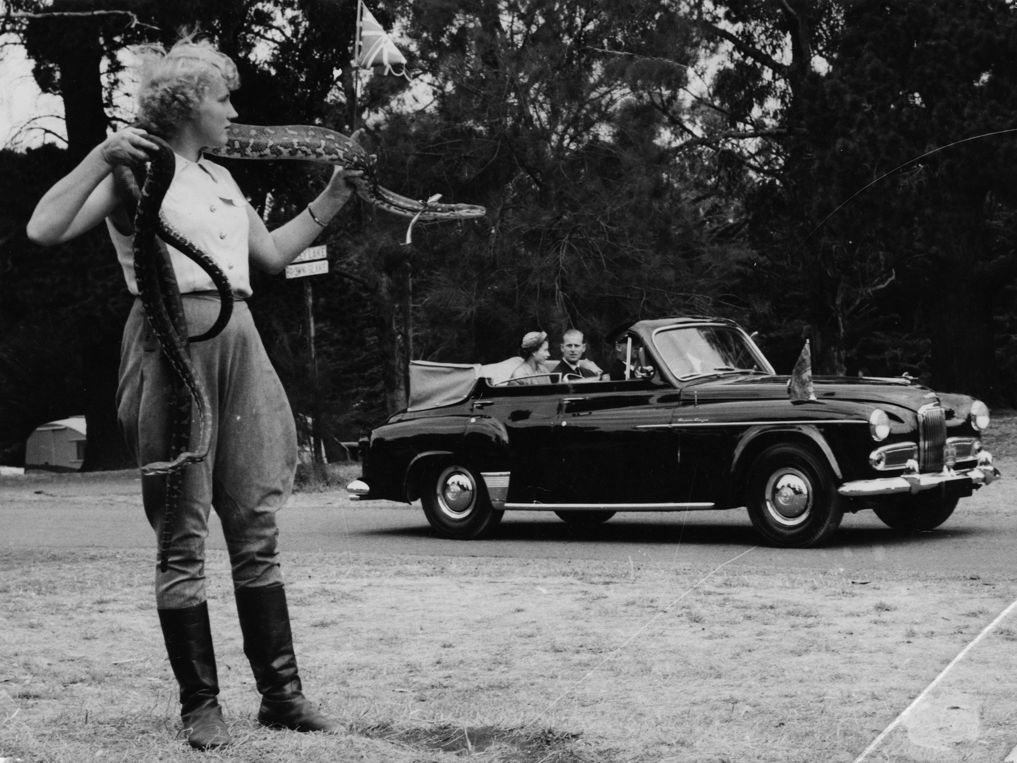 Queen Elizabeth II and Prince Philip watch Australia's Snake Girl, Shirley Weston