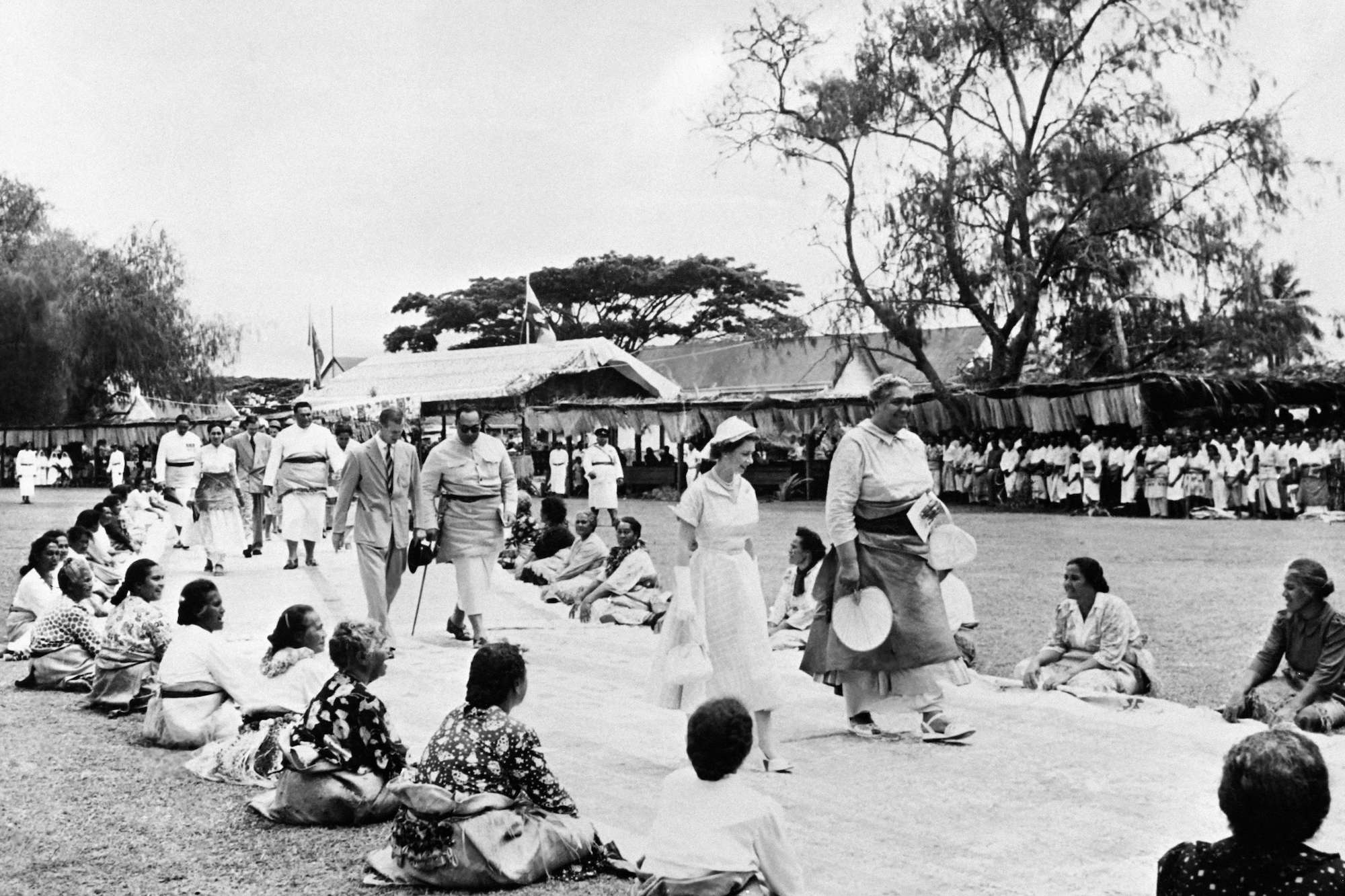 Queen Elizabeth II walks with Salote, Queen of Tonga in Nukualofa
