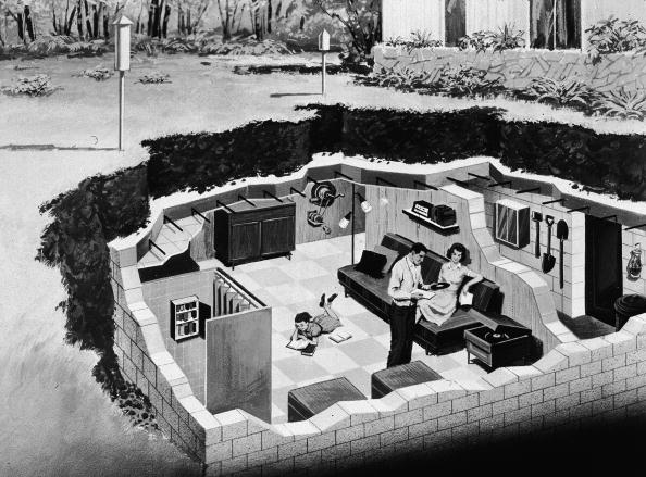 Illustration depicting a family in their backyard underground bomb shelter Illustration depicting a family in their backyard underground bomb shelter