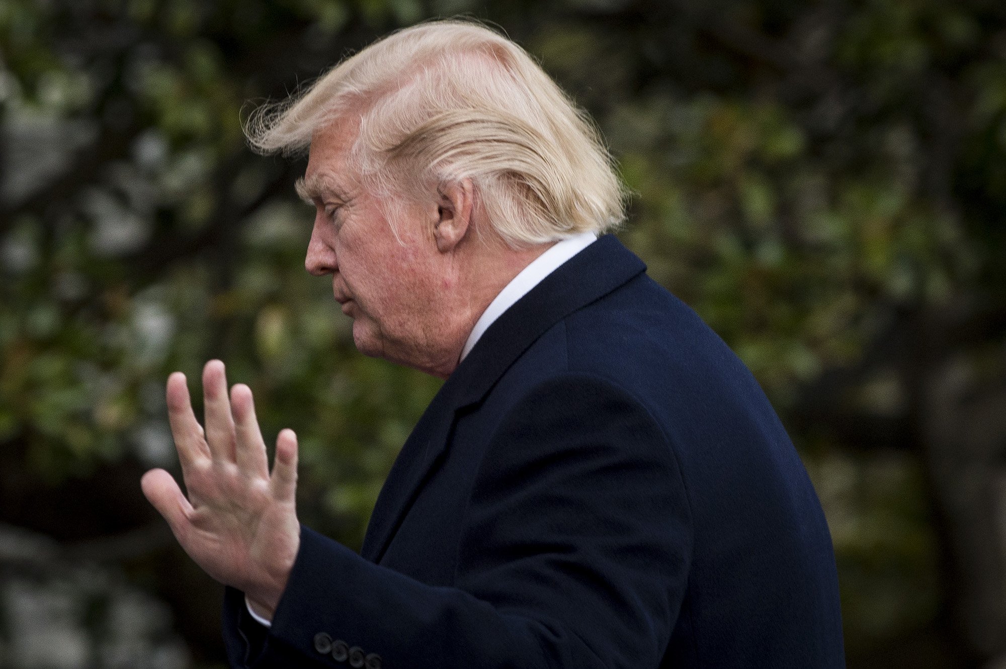 Donald Trump acknowledges the media as he walks to the residence