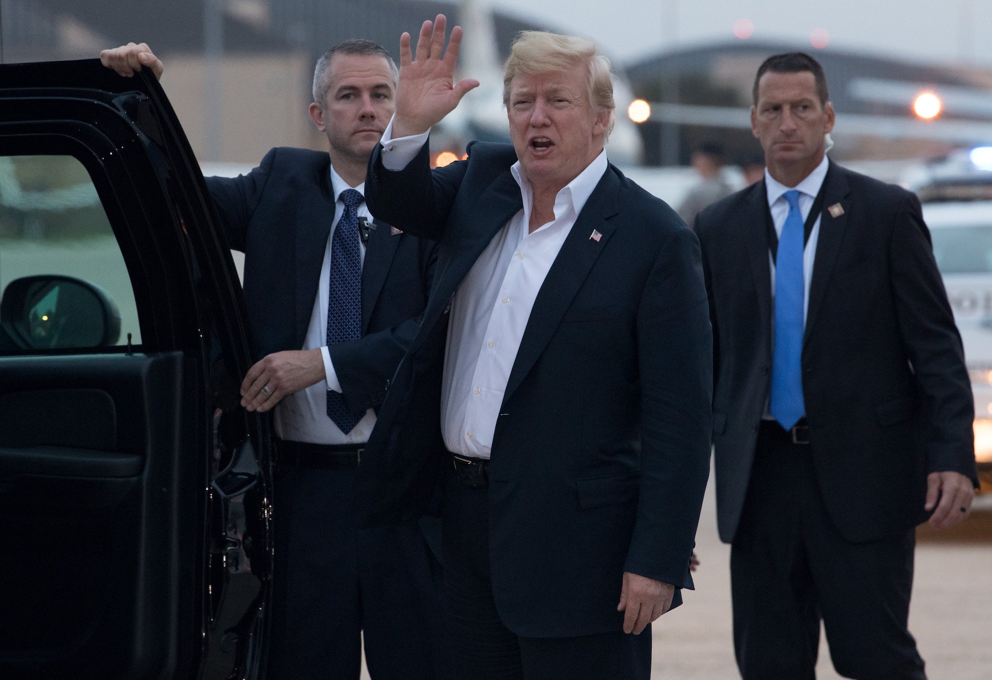 Donald Trump gets into his SUV after disembarking from Air Force One