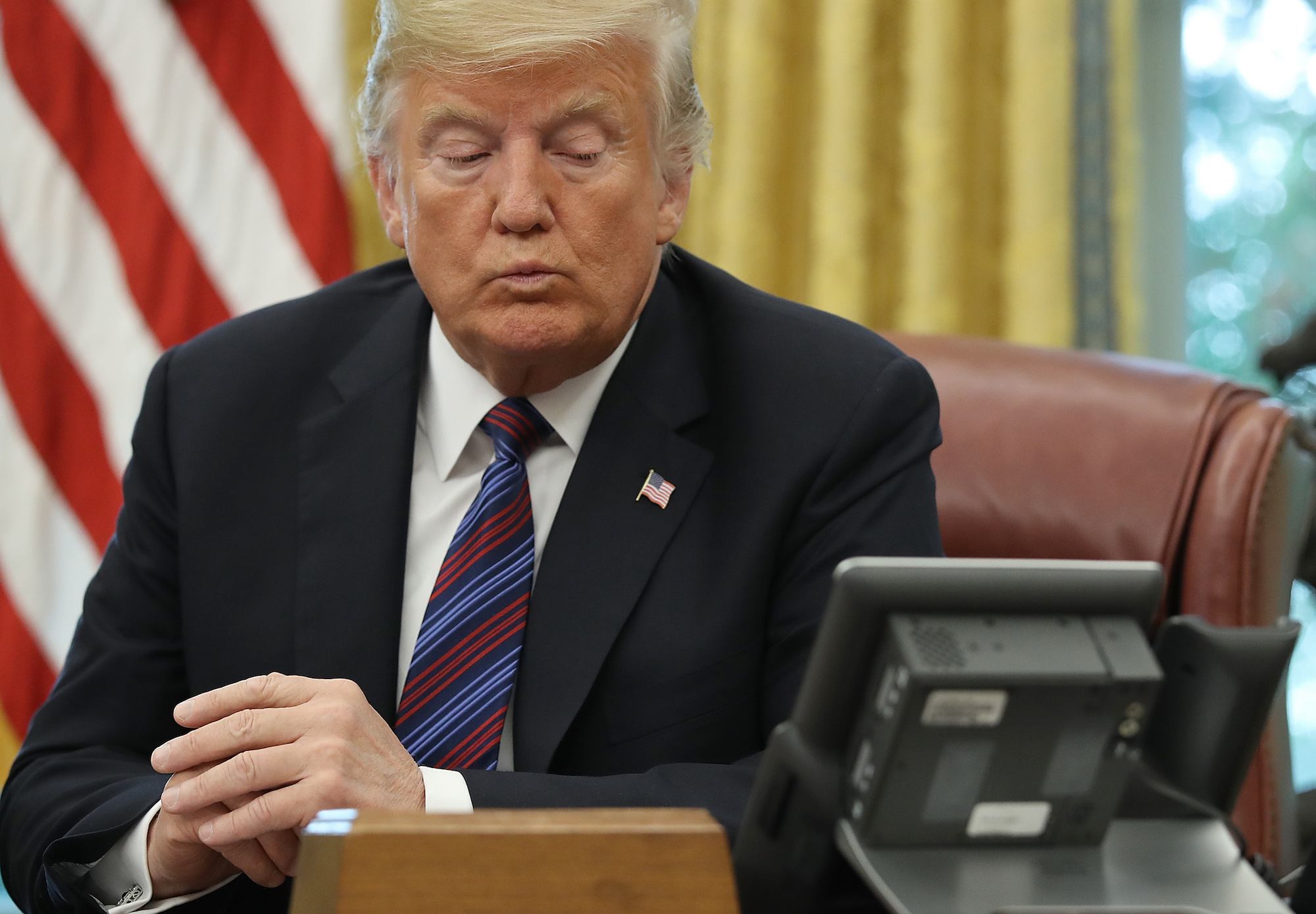 Donald Trump speaks on the telephone via speakerphone with Mexican President Enrique Pena Nieto