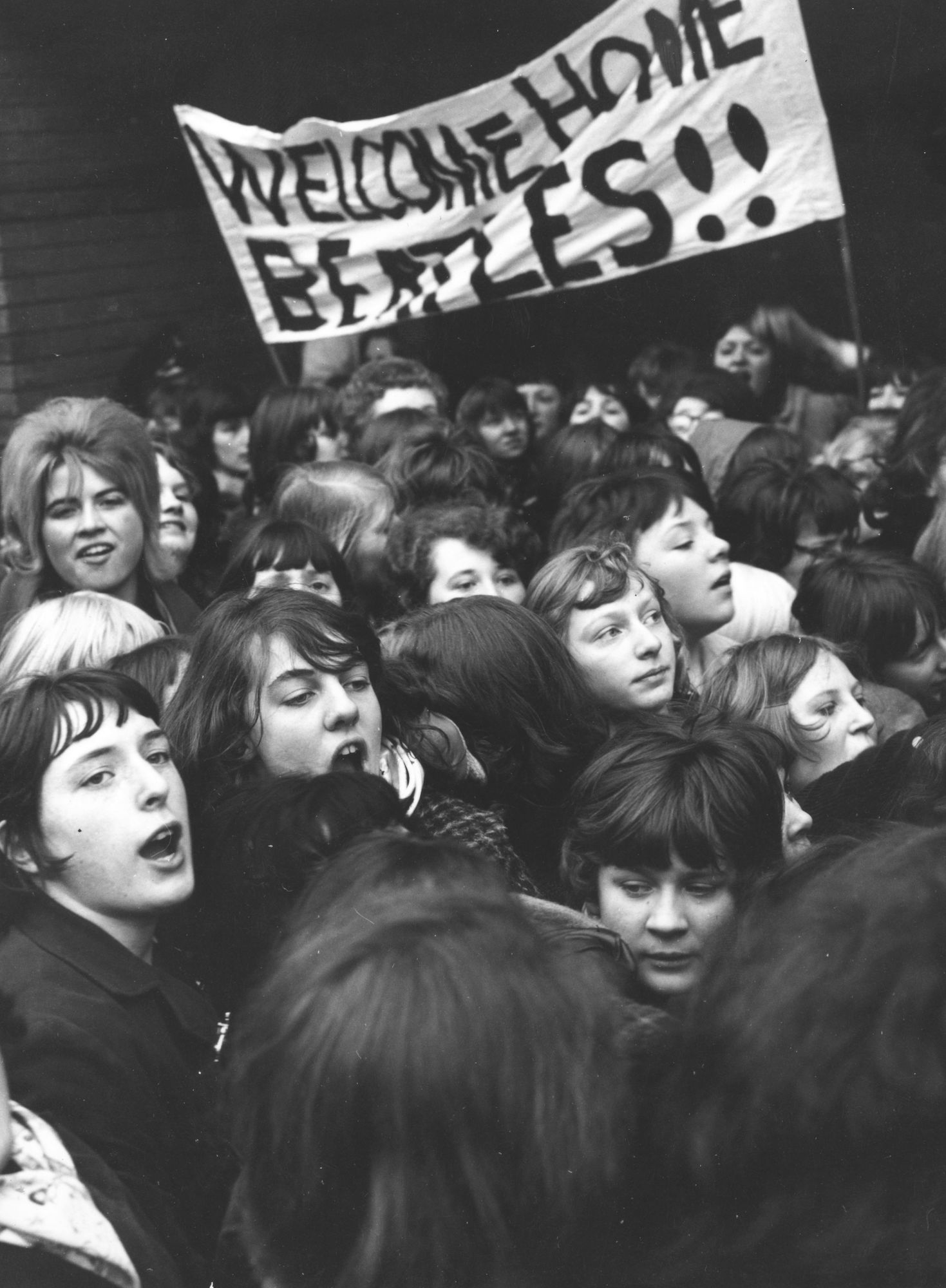 Fans welcome The Beatles home from their tour of the United States