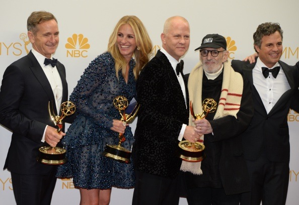 Actress Julia Roberts celebrates winning the Outstanding Television Movie Award for "The Normal Heart " in the press room during the 66th Emmy Awards