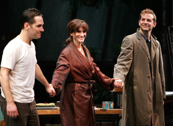Actors Paul Rudd, Julia Roberts and Bradley Cooper appear onstage during curtain call at the opening night of "Three Days of Rain" at the Bernard B. Jacobs Theatre on April 19, 2006 in New York City