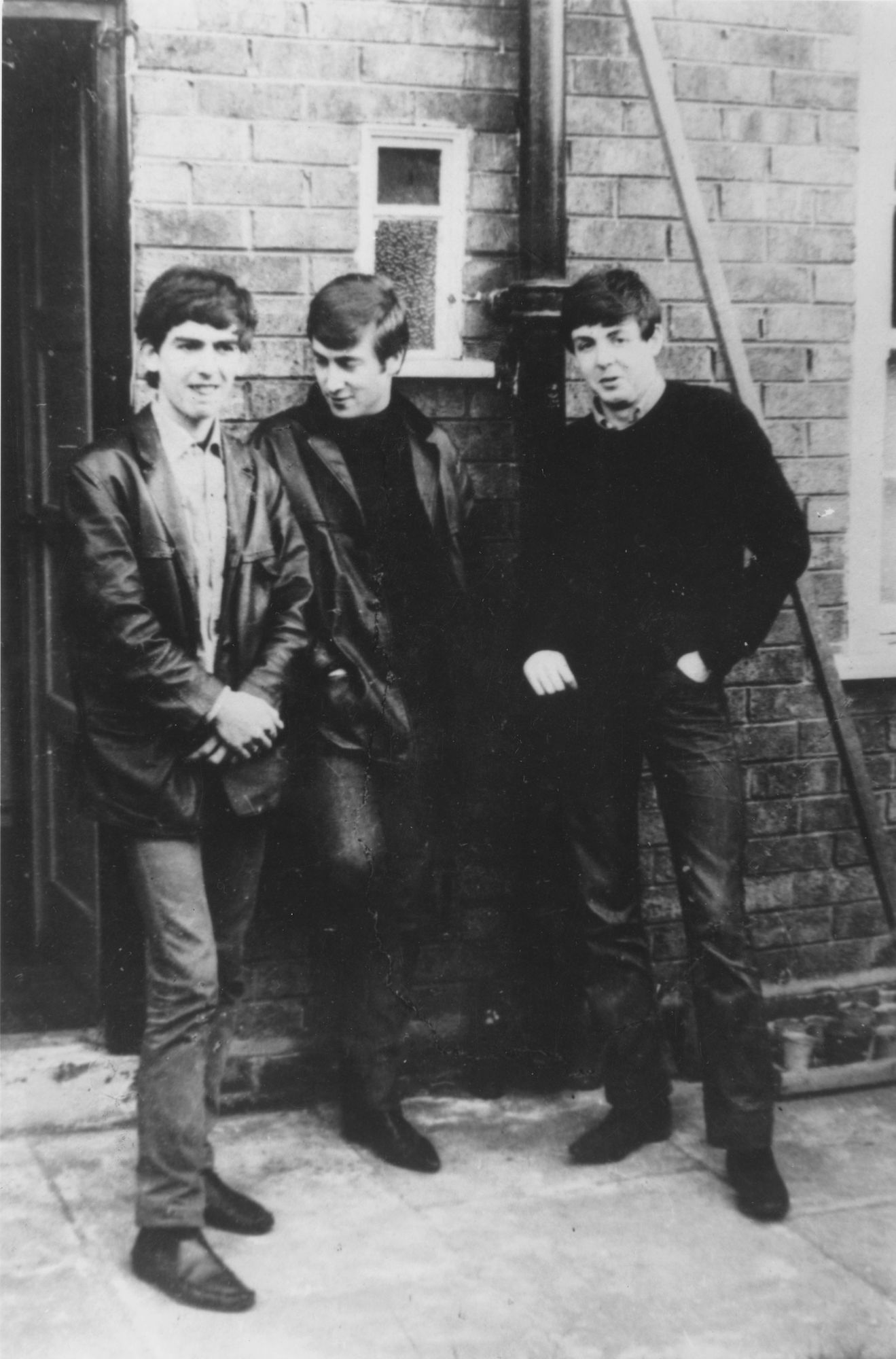 Liverpudlian skiffle beat band The Beatles standing outside Paul's Liverpool home