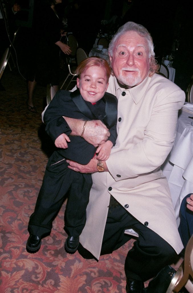 Comedian Marty Ingels, right, gives actor Josh Ryan Evans a squeeze at The Fifth Annual Golden Satellite Awards in 2001.